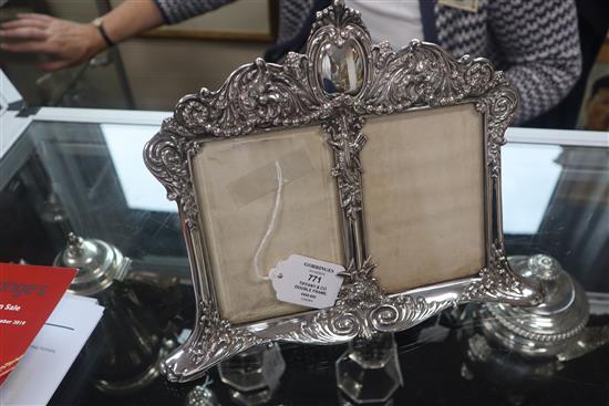 A late 19th/early 20th century Tiffany & Co Art Nouveau sterling silver double photograph frame, width 27.2cm.